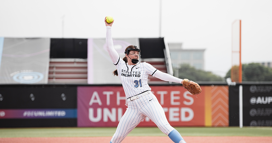 Kat Sandercock pitching in a blue striped Athletes Unlimited jersey. Sandercock was selected in the first round by the Bandits in the Allocation Draft.