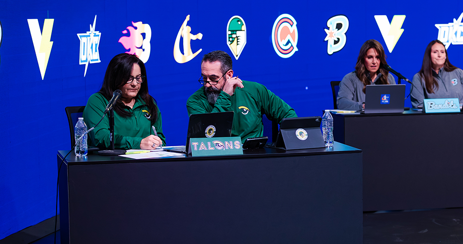 AUSL general managers and coaches sit at their respective tables for the allocation draft.