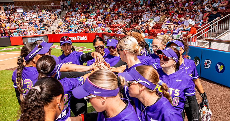 Volts team puts their hands in during a huddle at an AUSL game in Norman, Oklahoma